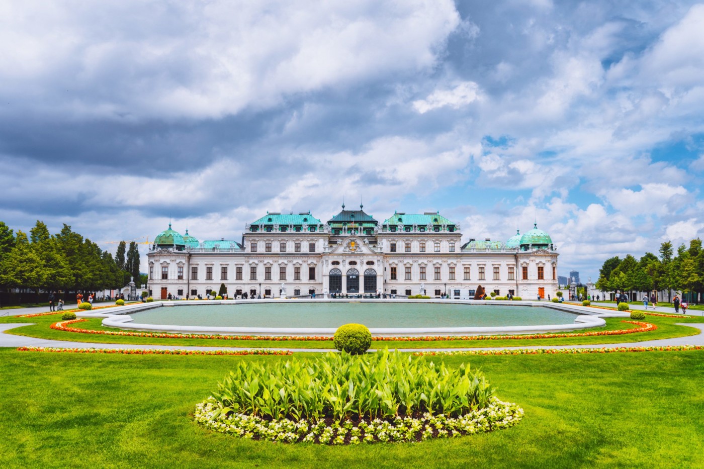 Belvedere palace Vienna Austria with spring flowers and cloudscape.