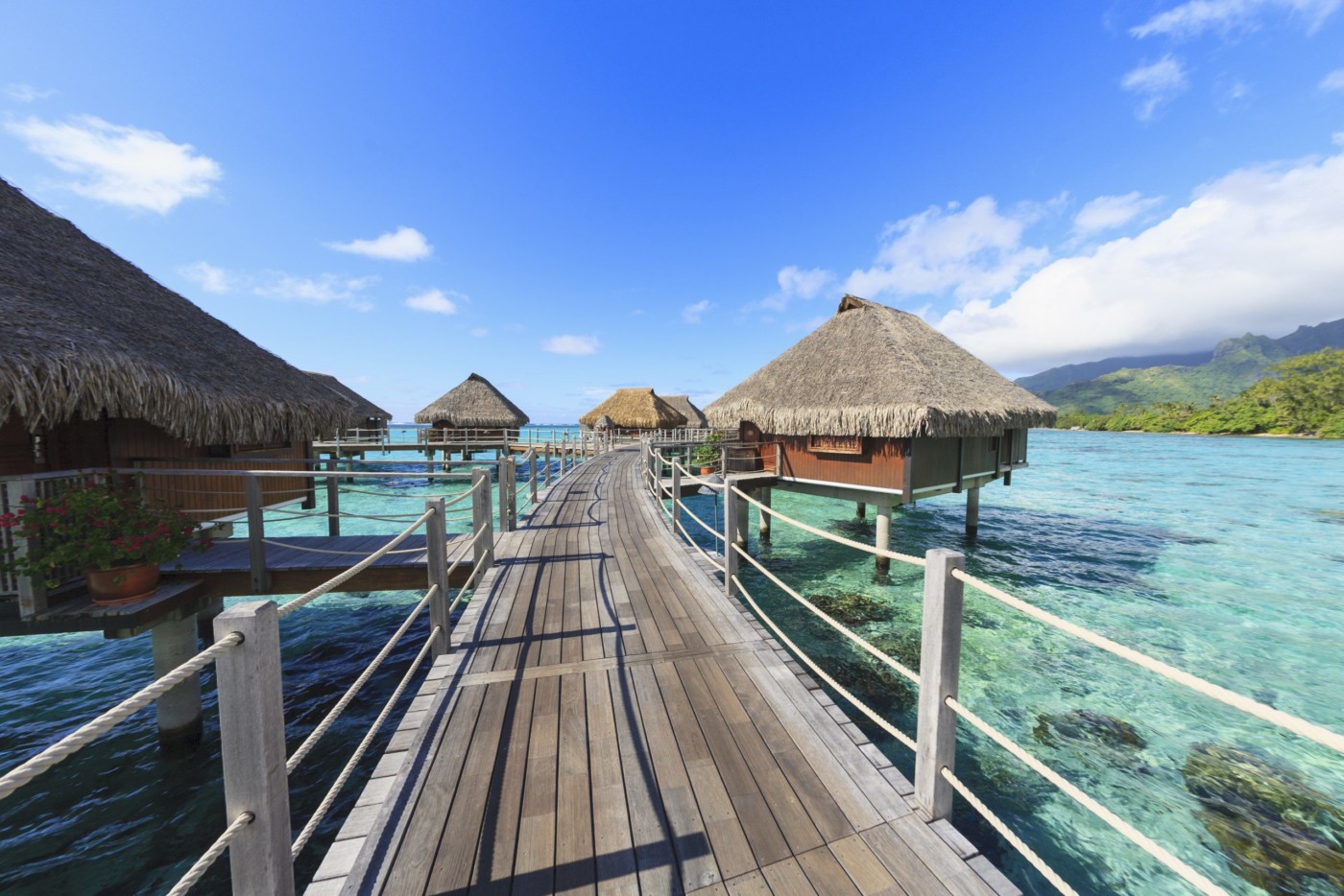 Decks connecting bungalows over tropical ocean, Bora Bora, French Polynesia