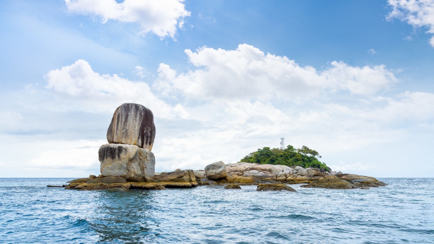 Beautiful nature landscape of Ko Hin Sorn small island with surprisingly overlap rocks in the Andaman Sea and sky in summer attractions near Koh Lipe at Tarutao National Park, Satun, Thailand