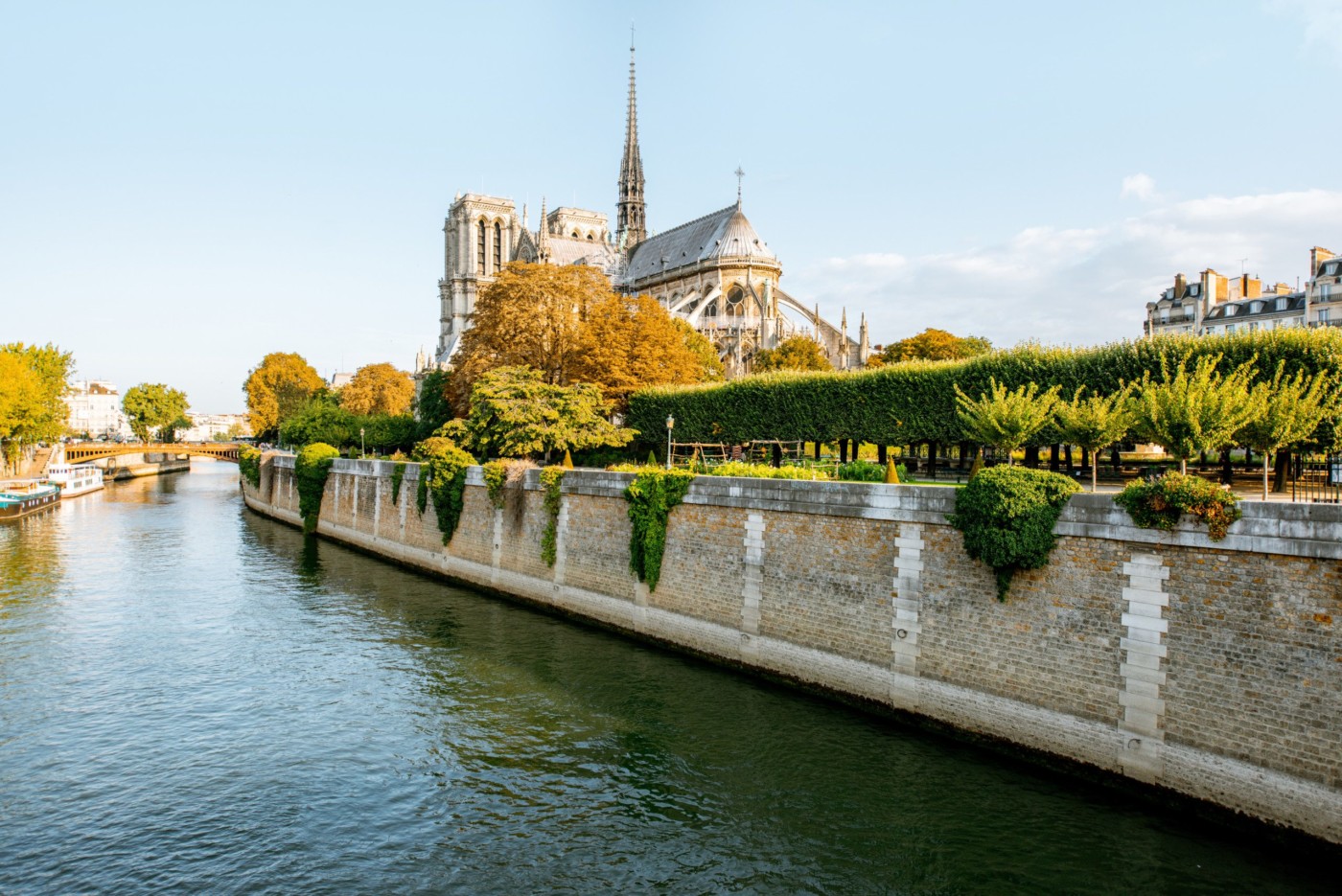 Landscape view on the famous Notre-Dame cathedral on Seine river during the morning light in Paris, France