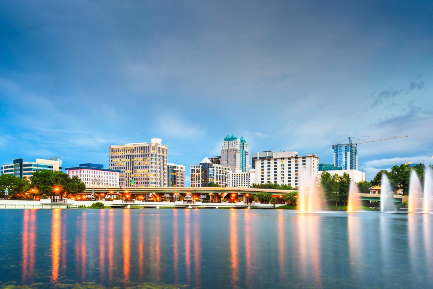 Orlando, Florida, USA aerial cityscape towards Lake Eola at dusk.