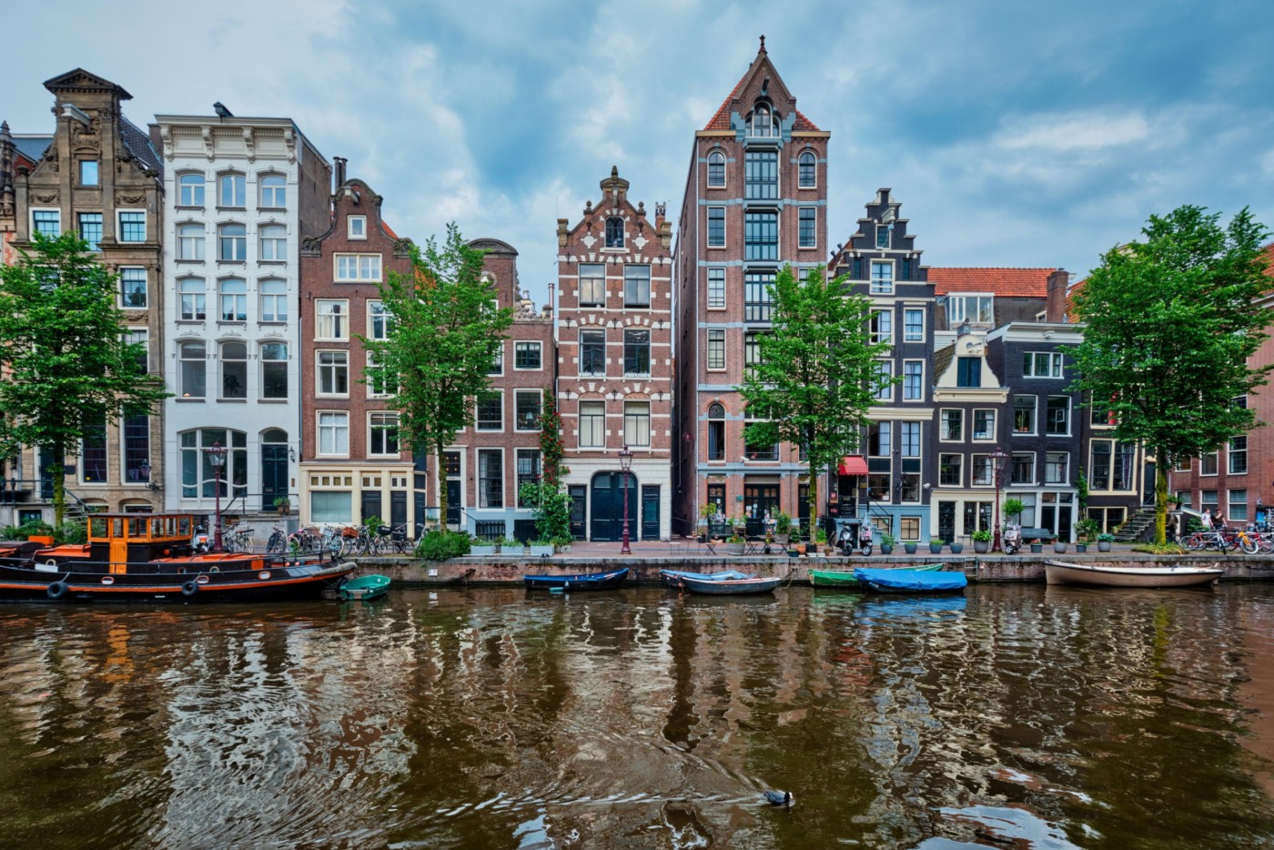Singel canal in Amsterdam with old houses. Amsterdam, Netherlands