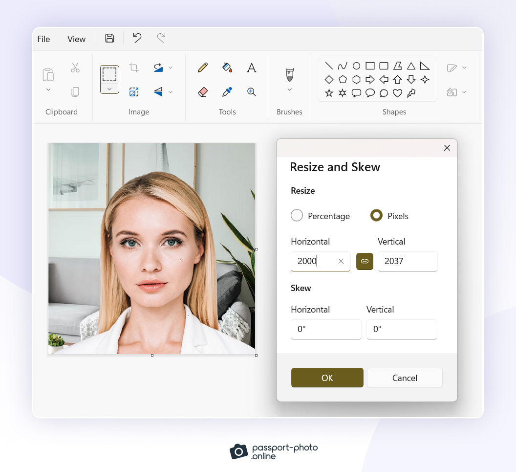 Making the aspect ratio of an image bigger in Microsoft Paint in order to fit the pixels required for a US passport photo.